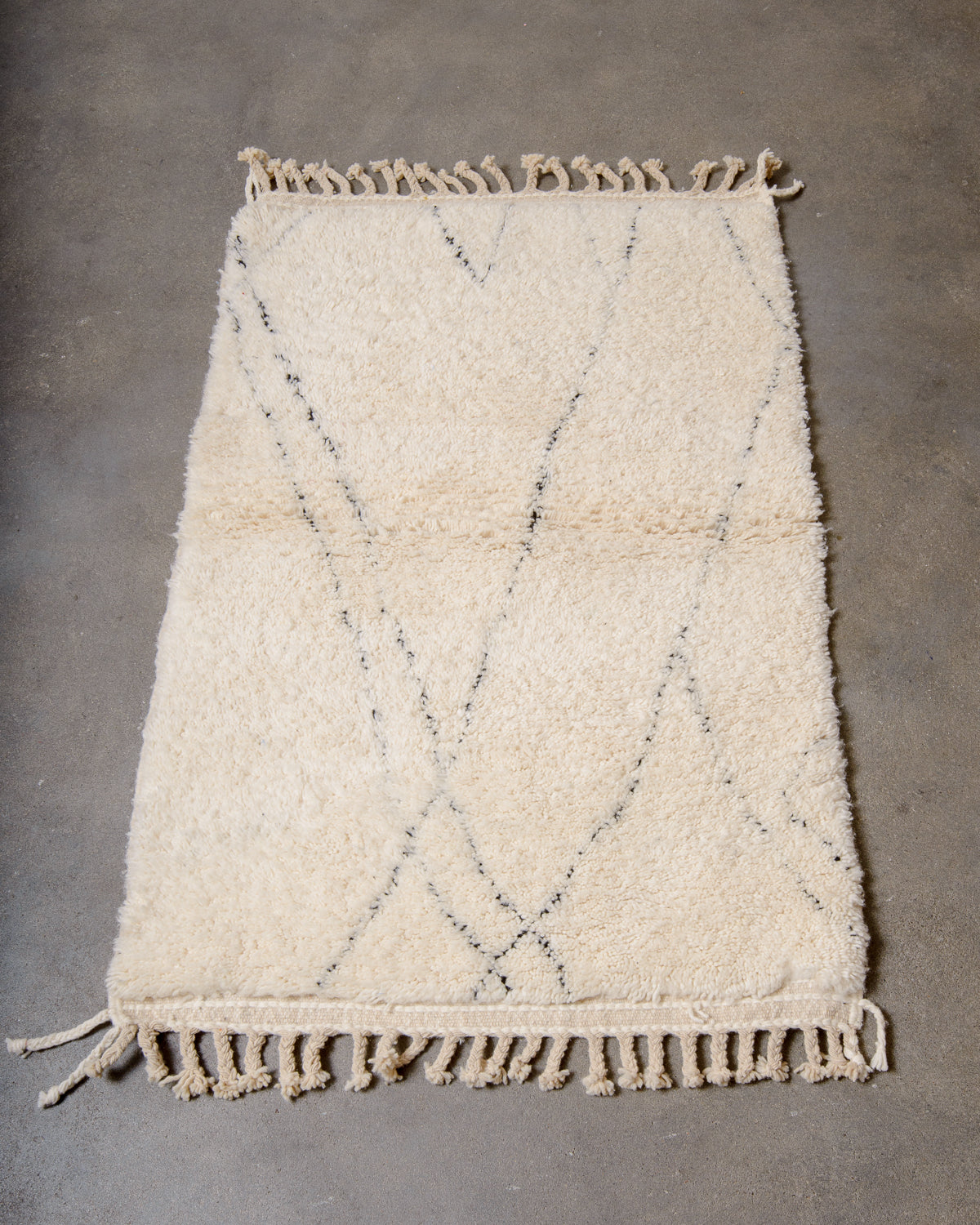 Modern, designer, handcrafted Berber rug from Morocco. Beniourain carpet with minimalist design, natural wool pile and a fluffy texture.